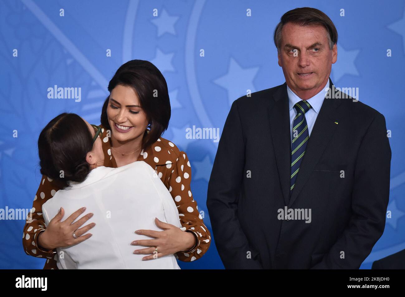 Alongside President Jair Bolsonaro and First Lady Michelle Bolsonaro, famous Brazilian novel actress, Regina Duarte, reacts during her inauguration ceremony as new Brazil`s Culture Secretary, at the Planalto Palace in Brasília, Brazil on March 4, 2020. Duarte takes over from Roberto Alvim, who was fired in January after publishing a video with references to Nazi cultural propaganda. (Photo by Andre Borges/NurPhoto) Stock Photo
